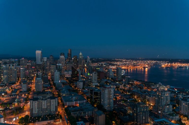 A breathtaking view of Seattle's skyline at twilight with city lights illuminating the urban landscape.
