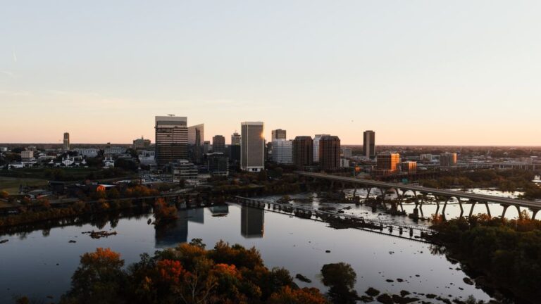 Aerial view of Richmond, Virginia skyline with James River at sunset.